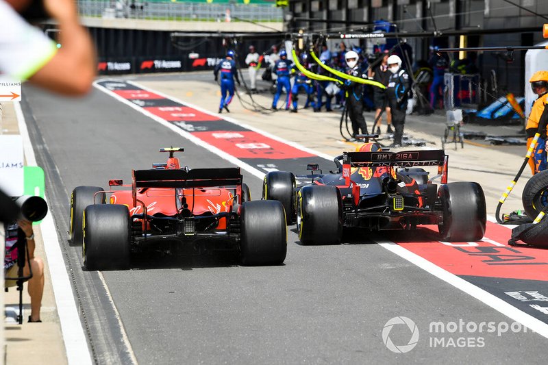 Charles Leclerc, Ferrari SF90 and Max Verstappen, Red Bull Racing RB15 wheel to wheel in the pit lane