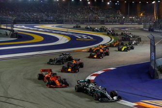 Lewis Hamilton, Mercedes AMG F1 W10, leads Sebastian Vettel, Ferrari SF90, Max Verstappen, Red Bull Racing RB15, Valtteri Bottas, Mercedes AMG W10, Alexander Albon, Red Bull Racing RB15, Carlos Sainz Jr., McLaren MCL34, and the remainder of the field at the start