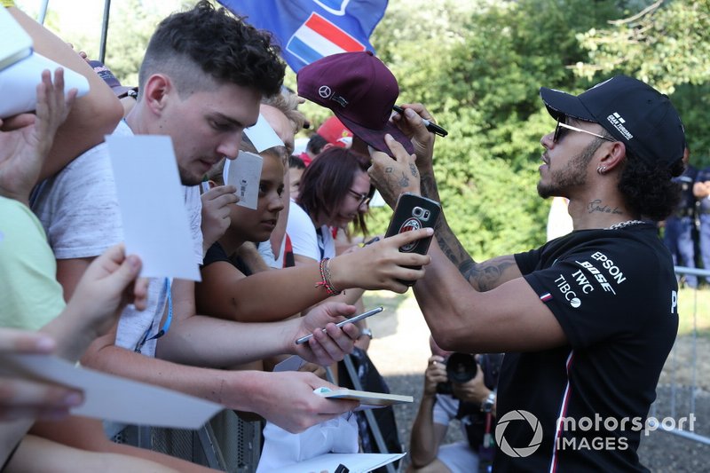 Lewis Hamilton, Mercedes AMG F1 signs an autograph for a fan