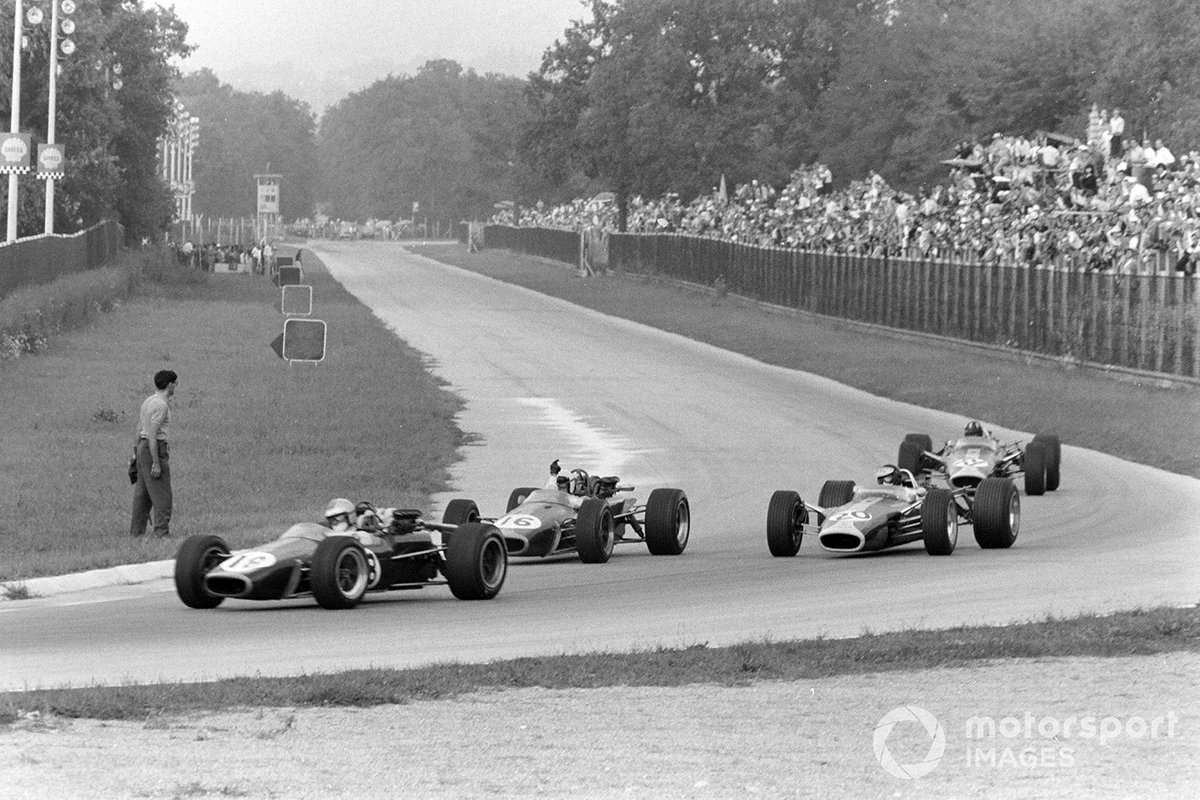 Denny Hulme, Brabham BT24 Repco, leads Jack Brabham, Brabham BT24 Repco, Jim Clark, Lotus 49 Ford, and Graham Hill, Lotus 49 Ford