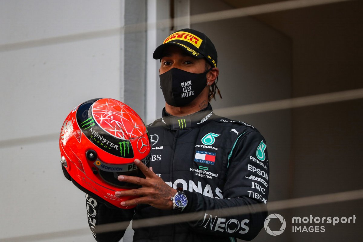 Lewis Hamilton, Mercedes-AMG F1, 1st position, with a helmet worn by Michael Schumacher in 2012