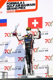 Louis Deletraz, Charouz Racing System celebrates ont he podium with the trophy