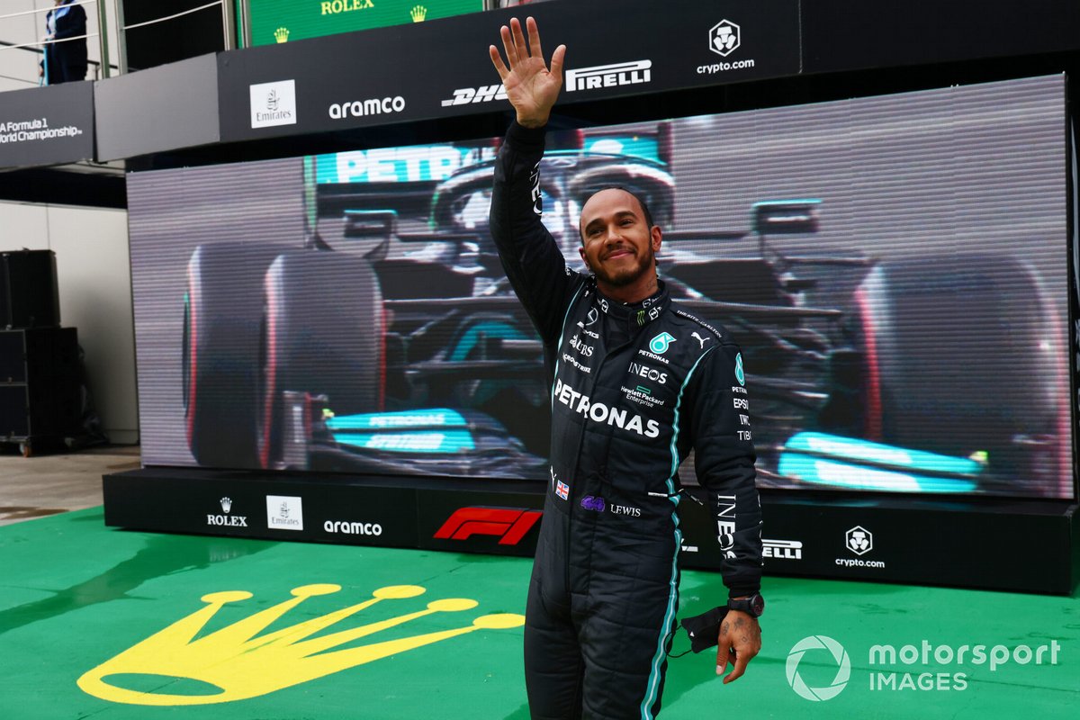 Pole man Lewis Hamilton, Mercedes, waves from Parc Ferme