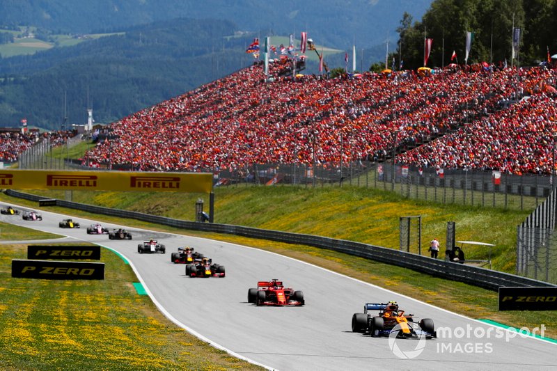 Lando Norris, McLaren MCL34, leads Sebastian Vettel, Ferrari SF90, Max Verstappen, Red Bull Racing RB15, and Pierre Gasly, Red Bull Racing RB15