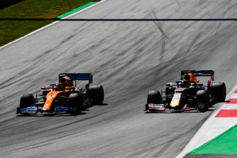 Lando Norris, McLaren MCL34, leads Max Verstappen, Red Bull Racing RB15