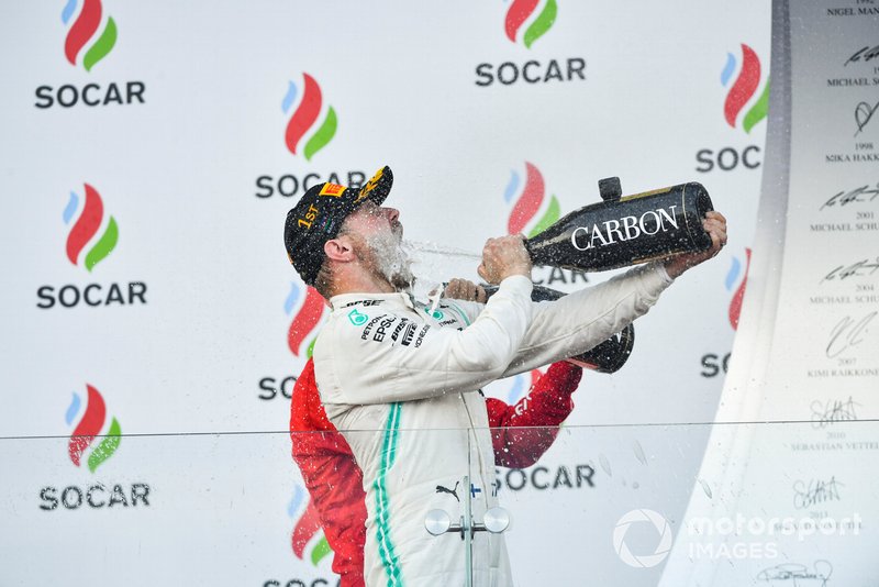 Valtteri Bottas, Mercedes AMG F1, 1st position, blasts himself with Champagne on the podium