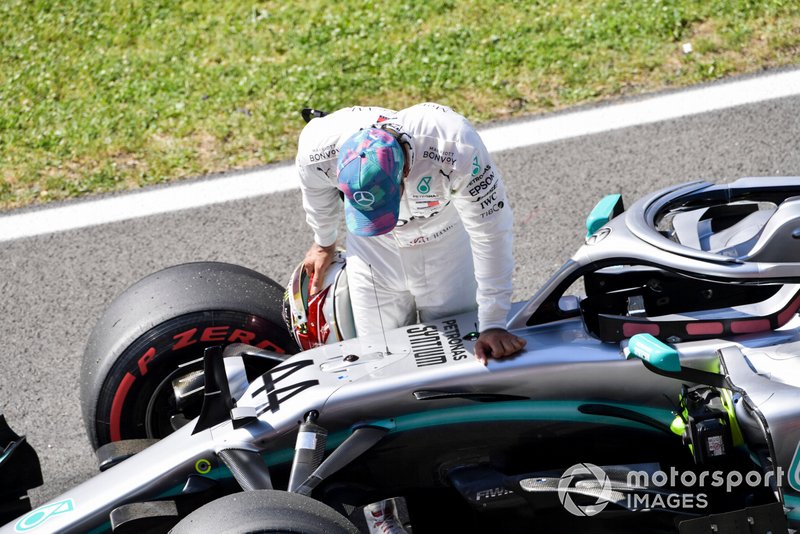 Lewis Hamilton, Mercedes AMG F1, inspects his car after Qualifying