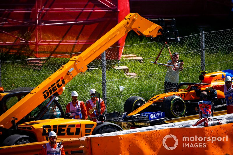 Car of Lando Norris, McLaren MCL34 being loaded on to the back of a low loader after a crash