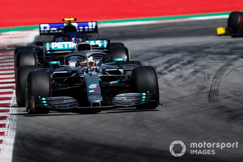 Lewis Hamilton, Mercedes AMG F1 W10, leads Alexander Albon, Toro Rosso STR14