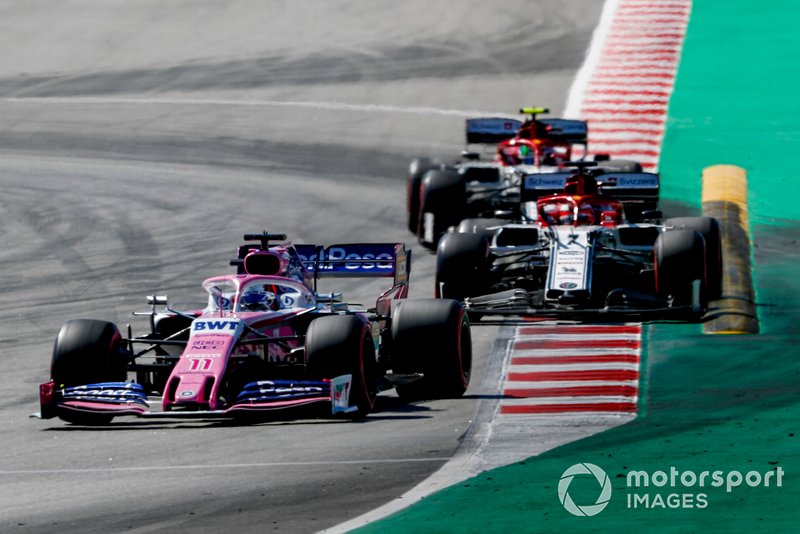 Sergio Perez, Racing Point RP19, leads Kimi Raikkonen, Alfa Romeo Racing C38, and Antonio Giovinazzi, Alfa Romeo Racing C38
