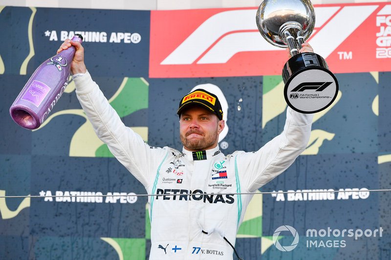 Valtteri Bottas, Mercedes AMG F1, 1st position, on the podium with his trophy and Champagne