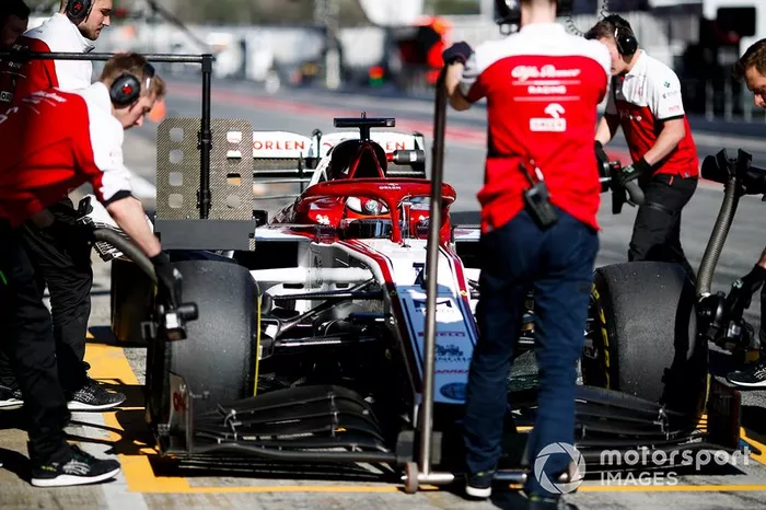 Kimi Raikkonen, Alfa Romeo Racing C39 being pushed by mechanics in the pit lane