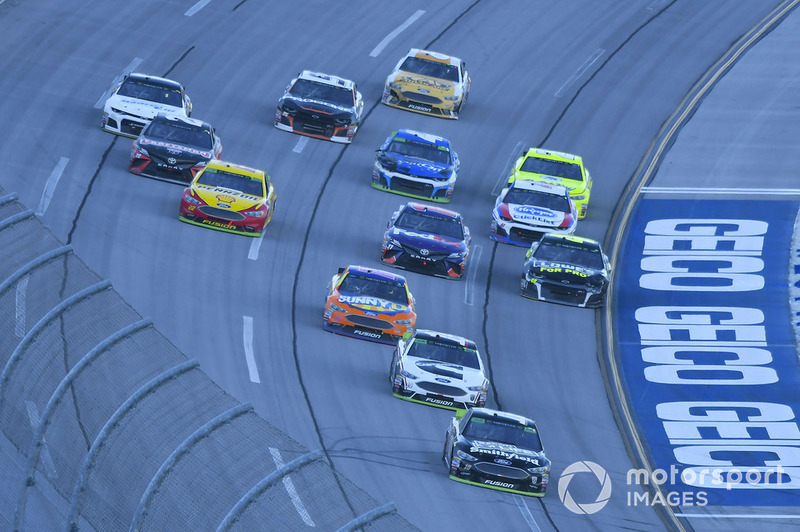 Aric Almirola, Stewart-Haas Racing, Ford Fusion Smithfield Bacon for Life crossing finish line