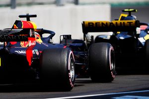 Daniel Ricciardo, Red Bull Racing RB14, follows Carlos Sainz Jr, Renault Sport F1 Team, in the pit lane