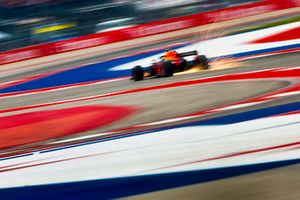 Sparks fly from the rear of Max Verstappen, Red Bull Racing RB14