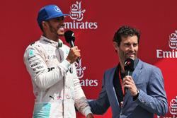 The podium (L to R): race winner Lewis Hamilton, Mercedes AMG F1 with Mark Webber, Porsche Team WEC