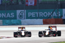 (L to R): Max Verstappen, Red Bull Racing RB12 battle for position with team mate Daniel Ricciardo,