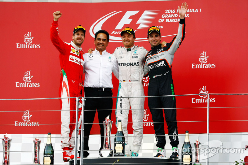 The podium (L to R): Sebastian Vettel, Ferrari, second; Nico Rosberg, Mercedes AMG F1, race winner;