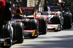 GP2 cars waiting to be pushed into the pit lane