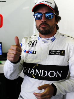 Fernando Alonso, McLaren MP4-31 gives a thumbs up in the garage