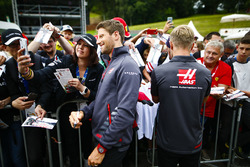 Romain Grosjean, Haas F1 Team, and Kevin Magnussen, Haas F1 Team, sign autographs for fans