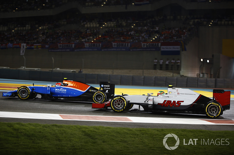 Esteban Ocon, Manor MRT05, leads Esteban Gutierrez, Haas VF-16