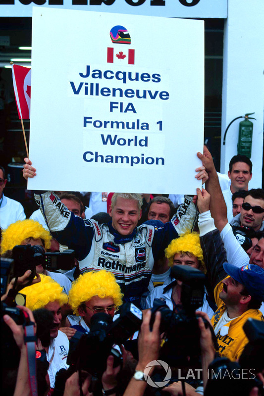 Jacques Villeneuve and his Williams crew celebrate Drivers World Championship title