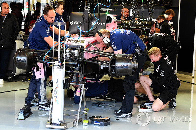 Sahara Force India VJM10 is worked on in the garage