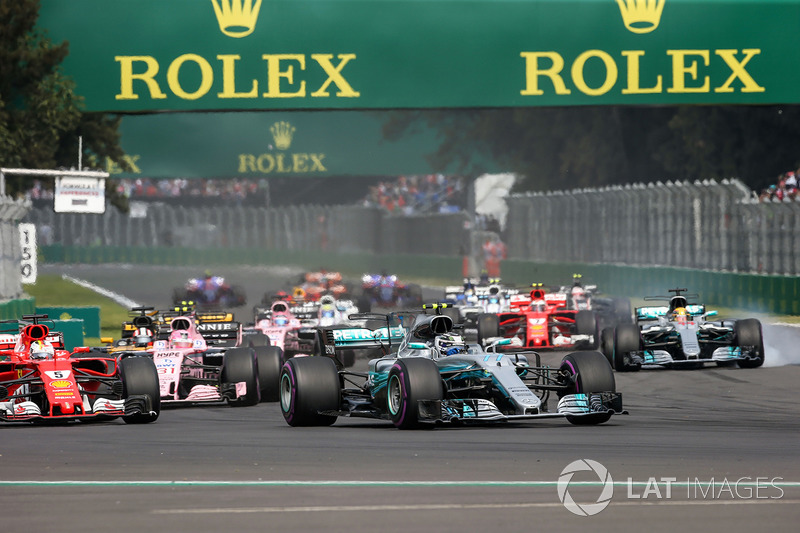 Valtteri Bottas, Mercedes-Benz F1 W08  and Lewis Hamilton, Mercedes-Benz F1 W08  with rear puncture at the start of the race after colliding with Sebastian Vettel, Ferrari SF70H