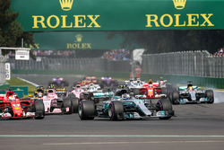 Valtteri Bottas, Mercedes-Benz F1 W08 and Lewis Hamilton, Mercedes-Benz F1 W08 with rear puncture at the start of the race after colliding with Sebastian Vettel, Ferrari SF70H