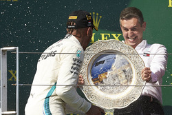 The Mercedes Constructors trophy delegate and race winner Lewis Hamilton, Mercedes AMG F1, on the podium