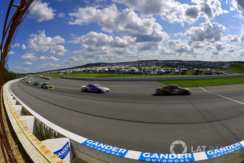 The field races into turn two