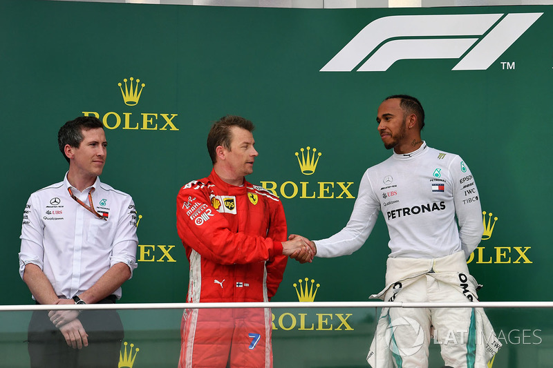 Kimi Raikkonen, Ferrari and Lewis Hamilton, Mercedes-AMG F1 celebrate on the podium