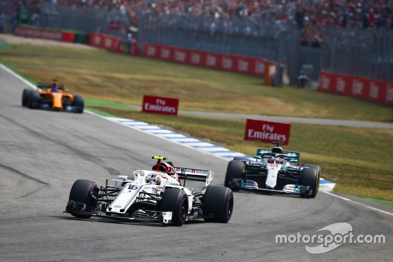 Charles Leclerc, Sauber C37, leads Lewis Hamilton, Mercedes AMG F1 W09