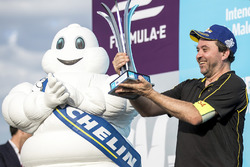 Michelin man on the podium with a member of the winning Techeetah team