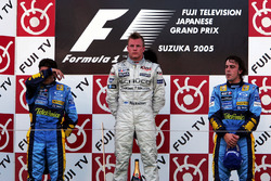 The podium: Giancarlo Fisichella, Renault, second; Kimi Raikkonen, McLaren, race winner; Fernando Al