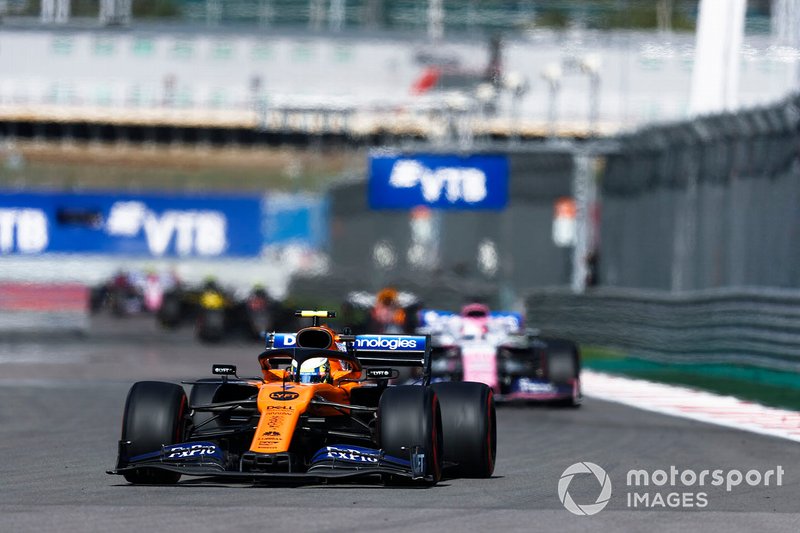 Lando Norris, McLaren MCL34, leads Sergio Perez, Racing Point RP19