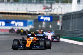 Lando Norris, McLaren MCL34, leads Sergio Perez, Racing Point RP19