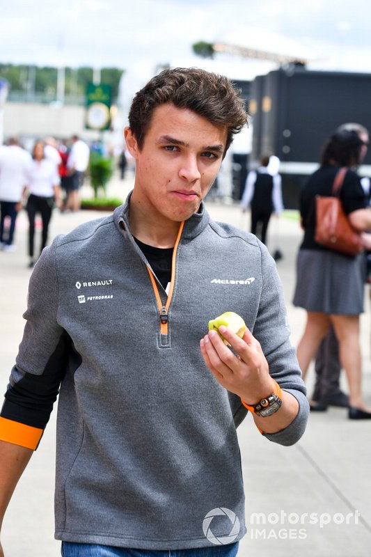 Lando Norris, McLaren eats an apple in the paddock