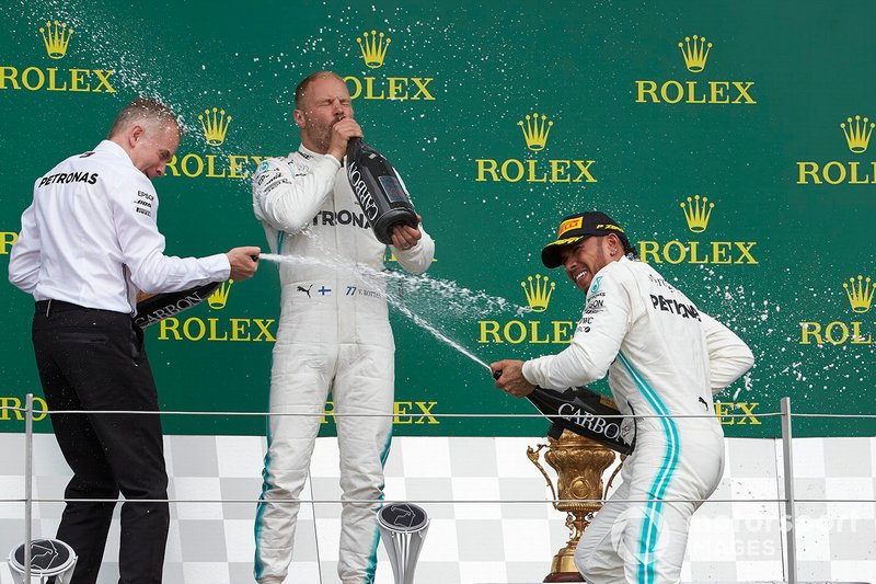 Valtteri Bottas, Mercedes AMG F1, 2nd position, and Lewis Hamilton, Mercedes AMG F1, 1st position, celebrate with Champagne