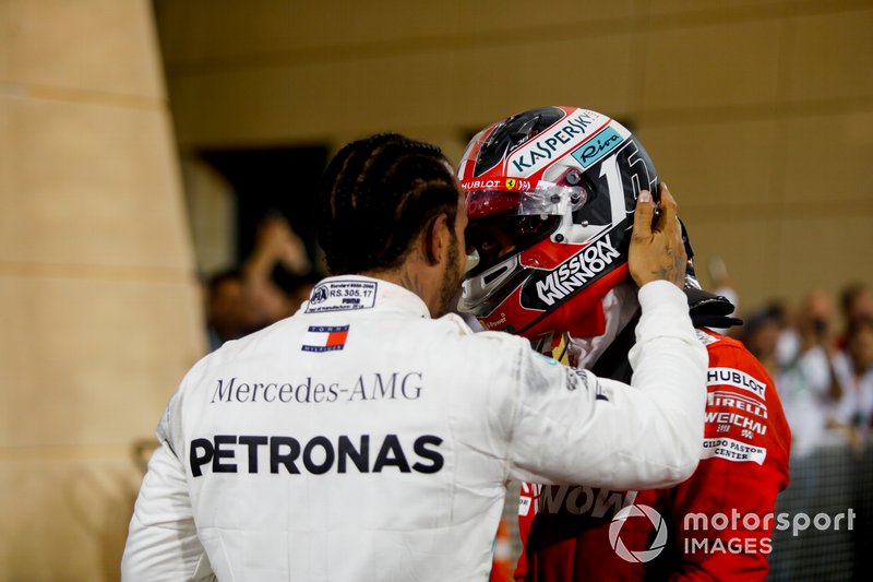 Lewis Hamilton, Mercedes AMG F1, 1st position, talks with Charles Leclerc, Ferrari, 3rd position, in Parc Ferme