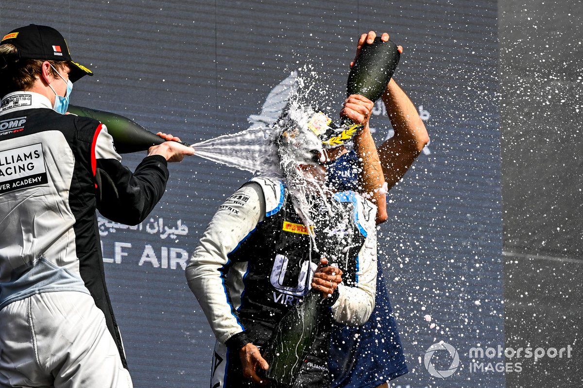 Dan Ticktum, Carlin and Race Winner Guanyu Zhou, Uni-Virtuosi Racing celebrate on the podium with the champagne