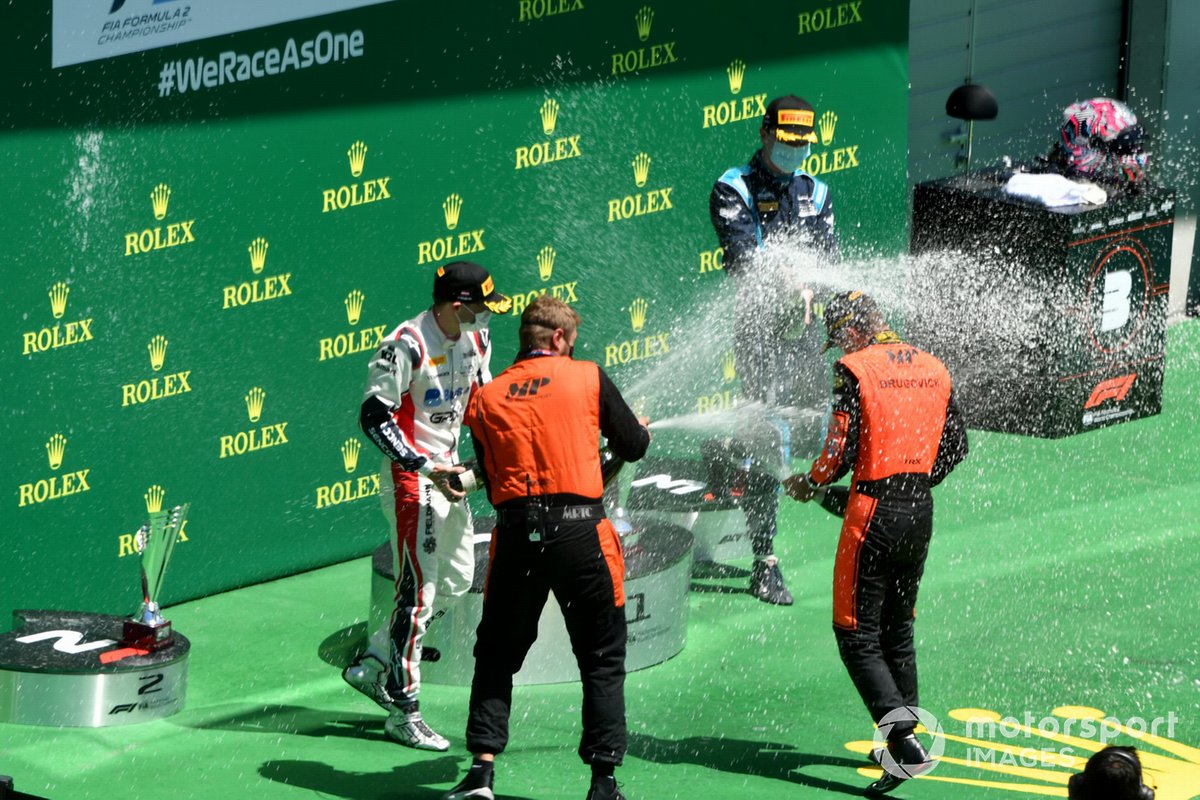 Felipe Drugovich, MP Motorsport, 1st position,  Louis Deletraz, Charouz Racing System, 2nd position, and Dan Ticktum, Dams, 3rd position, celebrate on the podium