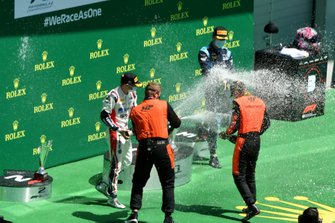 Felipe Drugovich, MP Motorsport, 1st position, Louis Deletraz, Charouz Racing System, 2nd position, and Dan Ticktum, Dams, 3rd position, celebrate on the podium