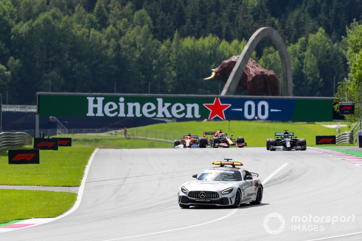 The Safety Car leads Lewis Hamilton, Mercedes F1 W11 EQ Performance, Max Verstappen, Red Bull Racing RB16, and Carlos Sainz Jr., McLaren MCL35