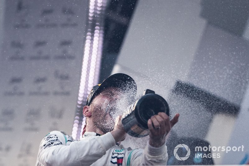 Valtteri Bottas, Mercedes AMG F1, 1st position, sprays himself with Champagne on the podium