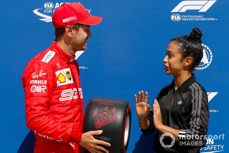Sebastian Vettel, Ferrari, is presented with his Pirelli Pole Position Award by actress Liza Koshy