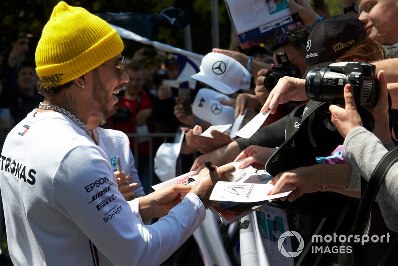 Lewis Hamilton, Mercedes AMG F1, signs autographs for fans