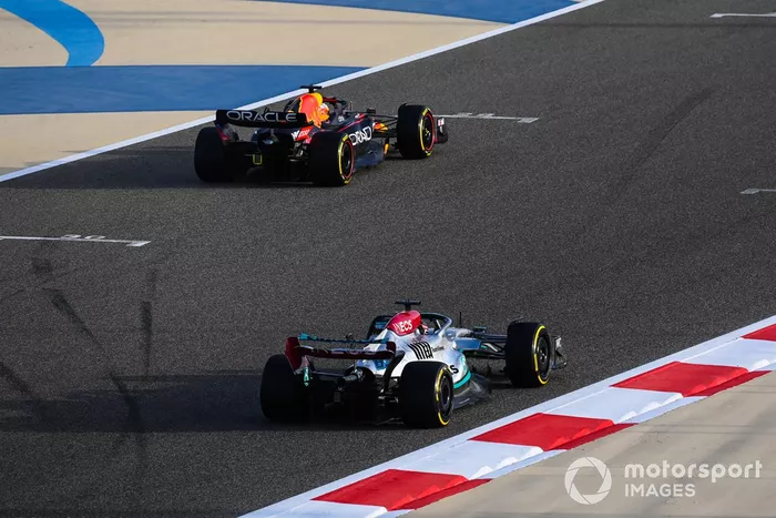 Max Verstappen, Red Bull Racing RB18, leads George Russell, Mercedes W13