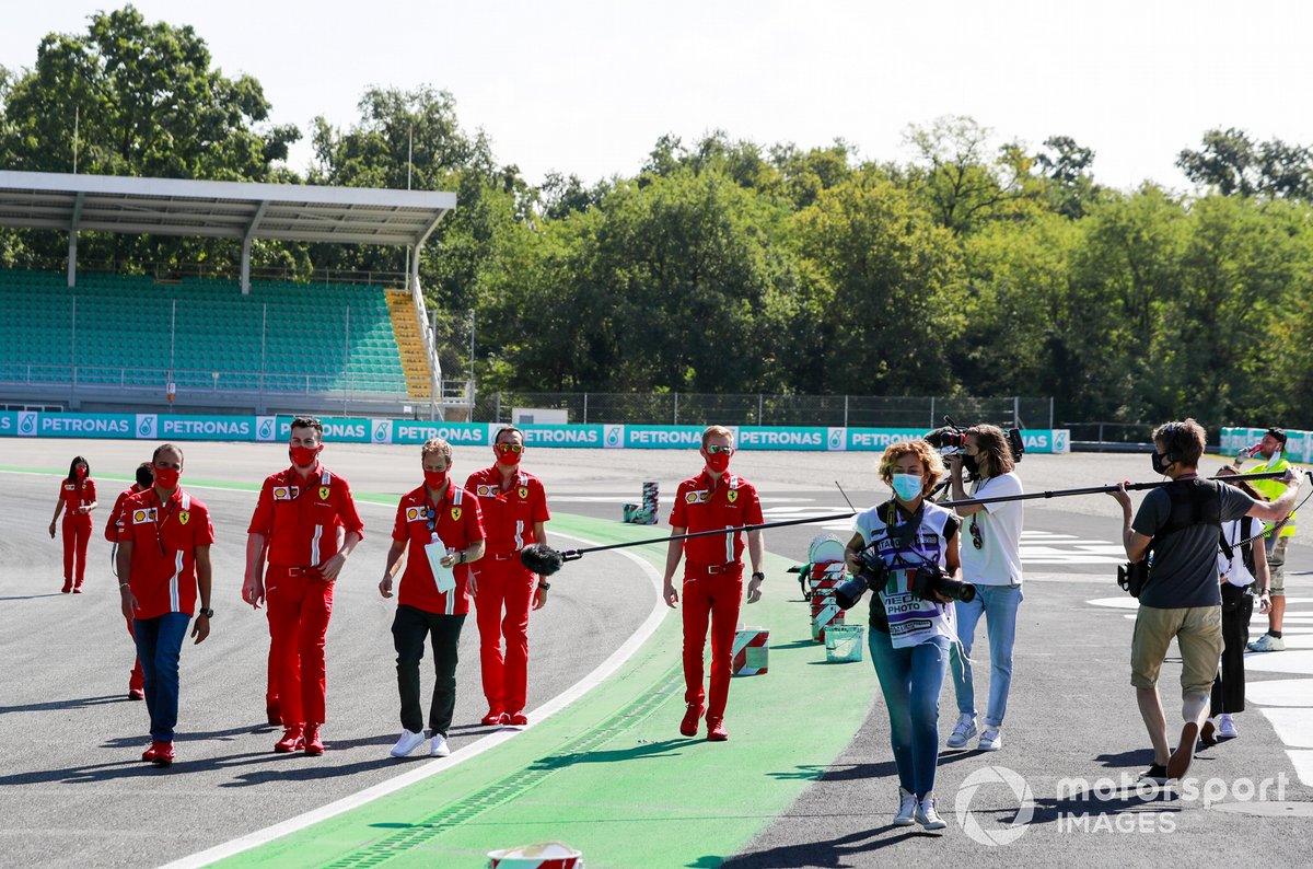 Sebastian Vettel, Ferrari, walks the track whilst being filmed